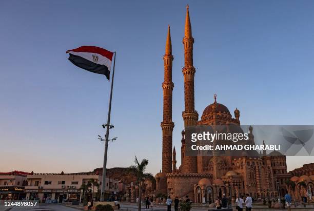 An Egyptian flag flies outside the Grand Mosque of al-Sahaba during the COP27 climate conference in Egypt's Red Sea resort city of Sharm el-Sheikh on...