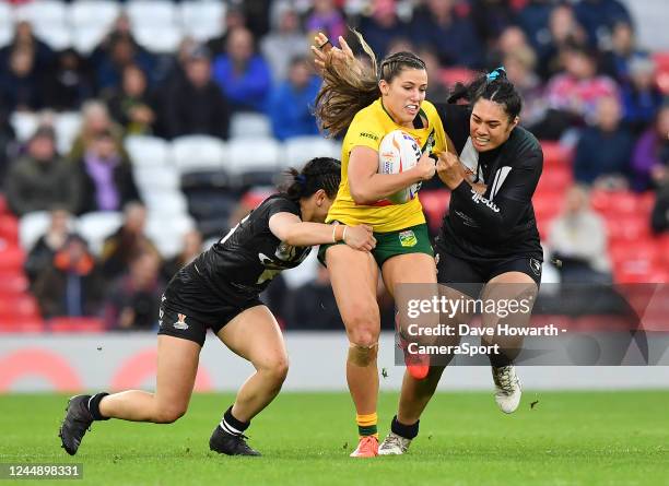 Australia's Shaylee Bent is tackled by New Zealand's Otesa Pule during Women's Rugby League World Cup Final match between Australia and New Zealand...