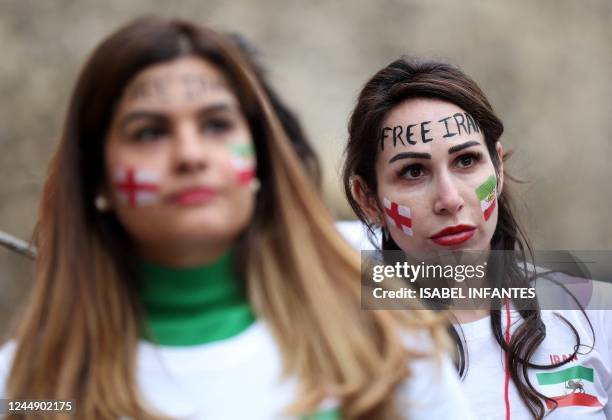 British-Iranian women take part in a demonstration opposite the Houses of Parliament in central London on November 19 ahead of Iran's fixture against...