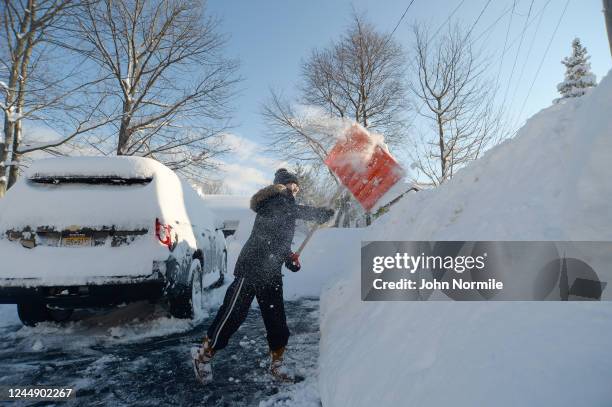 Heather Ahmed digs out after an intense lake-effect snowstorm impacted the area on November 19, 2022 in Hamburg, New York. Around Buffalo and the...