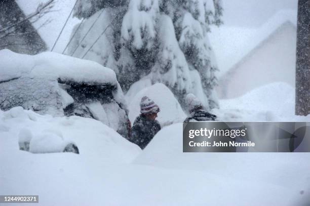 Braden Ahmed digs out after an intense lake-effect snowstorm impacted the area on November 18, 2022 in Hamburg, New York. Around Buffalo and the...