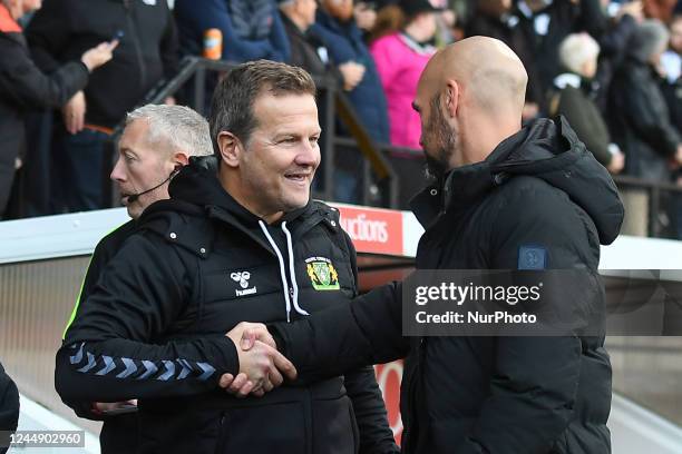 Mark Cooper, manager of Yeovil Town shakes hands with Luke Williams, manager of Notts County during the Vanarama National League match between Notts...