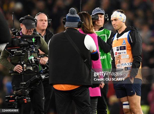 Leicester Tigers Rugby Union defence coach, Kevin Sinfield is interviewed on the pitch at half time during the Rugby League World Cup Men's final...