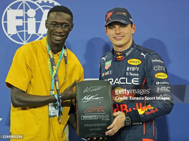 Social Media Influencer Khaby Lame of Senegal poses for photos with Oracle Red Bull Racing RB18 pilot Max Verstappen of Netherlands during qualifying...