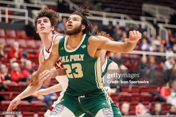 Cal Poly Mustangs C Bryan Penn-Johnson fights for position against Stanford Cardinal F Maxime Raynaud in the game between the Cal Poly Mustangs and...