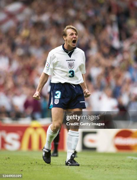 Stuart Pearce of England celebrates after scoring his shoot out penalty during the 1996 European soccer championship match between England and Spain...
