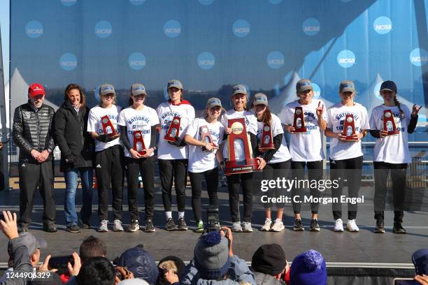 The NC State Wolfpack celebrate with the national championship trophy after winning the Division I Womens Cross Country Championship on November 19,...