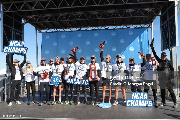 The Northern Arizona Lumberjacks celebrate with the national championship trophy after winning the Division I Mens Cross Country Championship on...