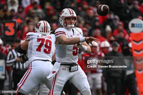 Quarterback Graham Mertz of the Wisconsin Badgers passes against the Nebraska Cornhuskers during the first quarter at Memorial Stadium on November...