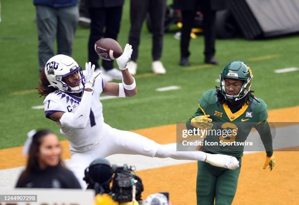 Horned Frogs WR Quentin Johnston bobbles a pass as Baylor Bears DB Mark Milton defends during the college football game between the TCU Horned Frogs...