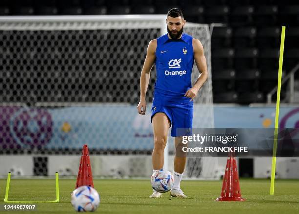 France's forward Karim Benzema takes part in a training session at the Jassim-bin-Hamad Stadium in Doha, ahead of the Qatar 2022 World Cup football...