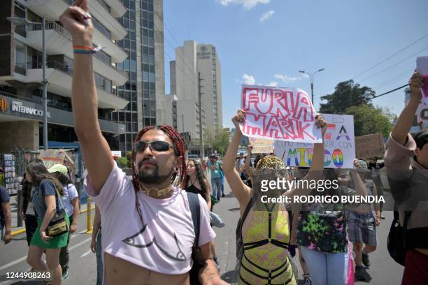 Sexual rights activists march on a street in northern Quito on November 19, 2022 during the 25th anniversary of the decriminalization of...