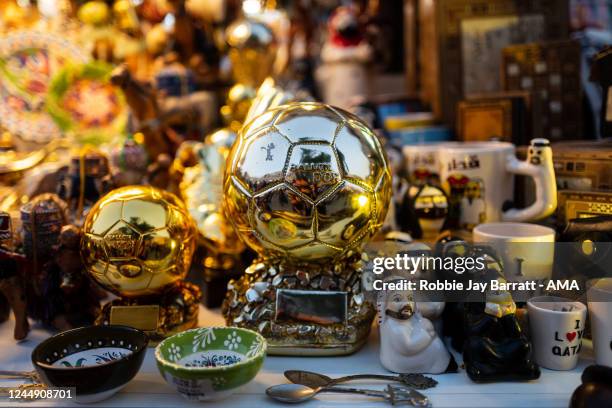 Ballon DOr replica trophy is seen amongst local trinkets at Souq Waqif, Doha ahead of the FIFA World Cup Qatar 2022 on November 19, 2022 in Doha,...