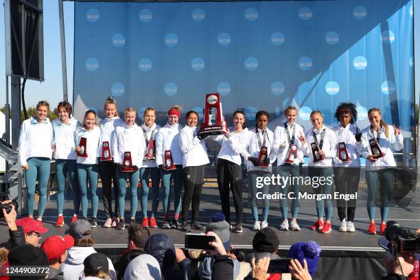 The New Mexico Lobos celebrate their second place finish after the Division I Womens Cross Country Championship on November 19, 2022 in Stillwater,...