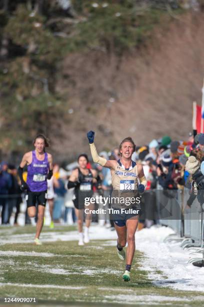 Alex Phillip of John Carroll celebrates at the finish line during the Division III Mens and Womens Cross Country Championships held at Forest Akers...