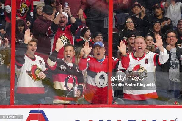 Fans cheer a highlight reel glove save by Cam Talbot of the Ottawa Senators during an NHL game against the New Jersey Devils at Canadian Tire Centre...