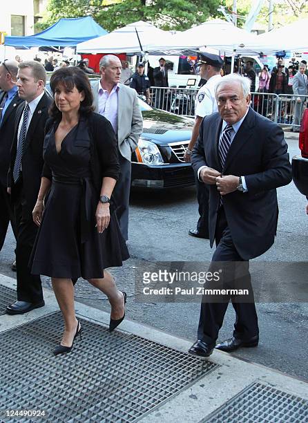 Dominique Strauss-Kahn and Anne Sinclair arrive at Manhattan Criminal Court to attend a status hearing on the sexual assault charges against...