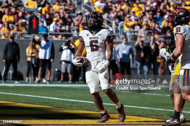 Oregon State Beavers running back Damien Martinez celebrates after scoring a touchdown during the college football game between the Oregon State...