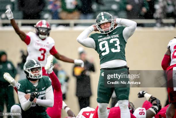 Ben Patton of the Michigan State Spartan reacts to missing a field goal, forcing the game into overtime, against the Indiana Hoosiers during the...