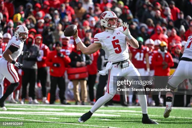 Quarterback Graham Mertz of the Wisconsin Badgers passes against the Nebraska Cornhuskers during the first quarter at Memorial Stadium on November...