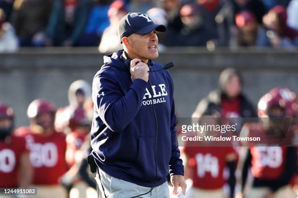 Head coach Tony Reno of the Yale Bulldogs watches the action against the Harvard Crimson during the second half at Harvard Stadium on November 19,...