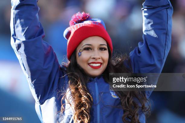 Kansas Jayhawks cheerleader tris to stay warm on a cold day during a Big 12 college football game between the Texas Longhorns and Kansas Jayhawks on...