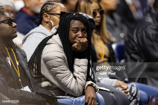 Family member of a shooting victim mourns during a memorial service for three slain University of Virginia football players Lavel Davis Jr., D'Sean...