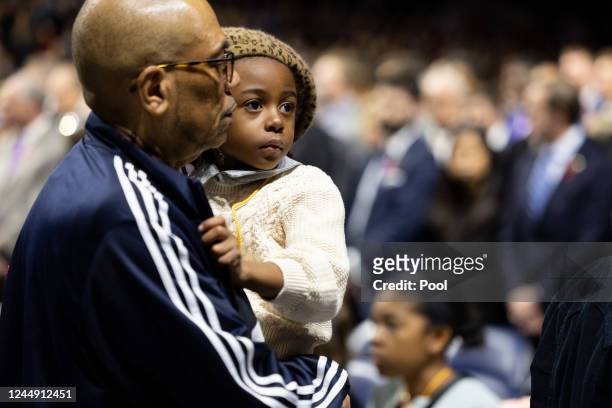 Young family member of a shooting victim attends a memorial service for three slain University of Virginia football players Lavel Davis Jr., D'Sean...