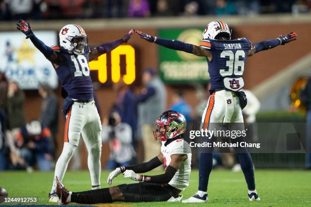 Cornerback Nehemiah Pritchett of the Auburn Tigers and cornerback Jaylin Simpson of the Auburn Tigers celebrate after tackling wide receiver Jaylen...