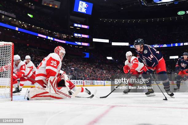 Gustav Nyquist of the Columbus Blue Jackets skates with the puck as Moritz Seider of the Detroit Red Wings defend during the first period of a game...