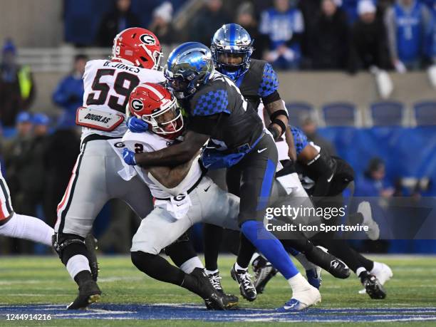 Kentucky Wildcats Linebacker J.J. Weaver tackles Georgia Bulldogs Running Back Kendall Milton during the college football game between the Georgia...