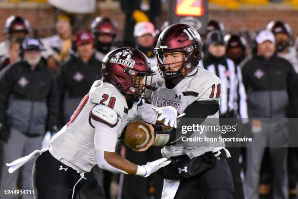 New Mexico State Aggies quarterback Diego Pavia hands off to New Mexico State Aggies running back Tim Gans during a non conference game between the...