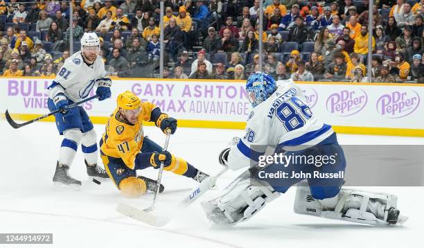 Michael McCarron of the Nashville Predators is called for interference as he slides into goalie Andrei Vasilevskiy of the Tampa Bay Lightning during...