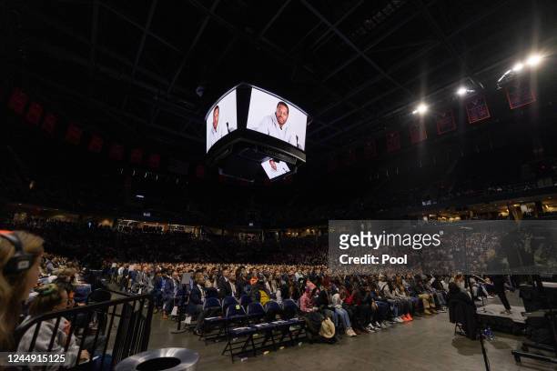 Attendees watch a pre-recorded video during a memorial service for three slain University of Virginia football players Lavel Davis Jr., D'Sean Perry...