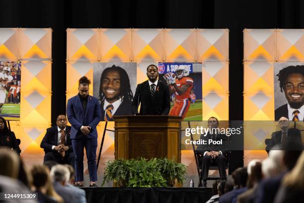 Football player speaks to a crowd during a memorial service for three slain University of Virginia football players Lavel Davis Jr., D'Sean Perry and...