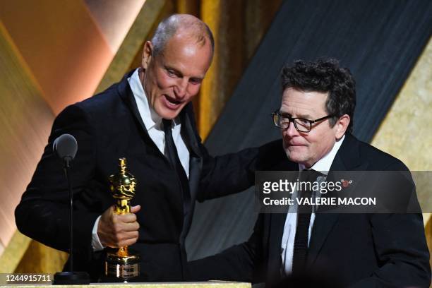 Actor Woody Harrelson presents honoree Canadian-American actor Michael J. Fox with the Jean Hersholt Humanitarian Award during the Academy of Motion...