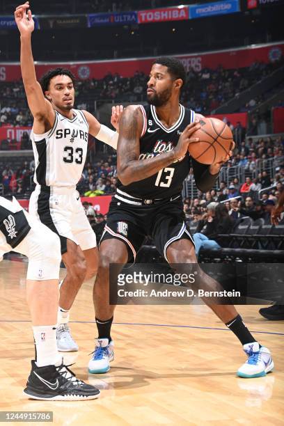Paul George of the LA Clippers handles the ball during the game against the San Antonio Spurs on November 19, 2022 at Crypto.Com Arena in Los...