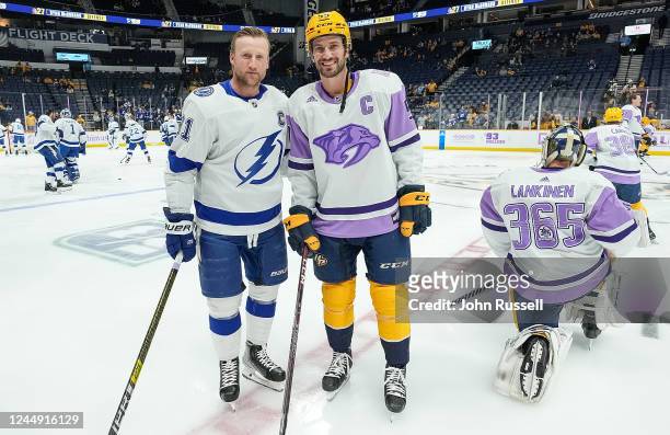 Roman Josi of the Nashville Predators and Steven Stamkos of the Tampa Bay Lightning pose for a photo during warmups prior to an NHL game against the...