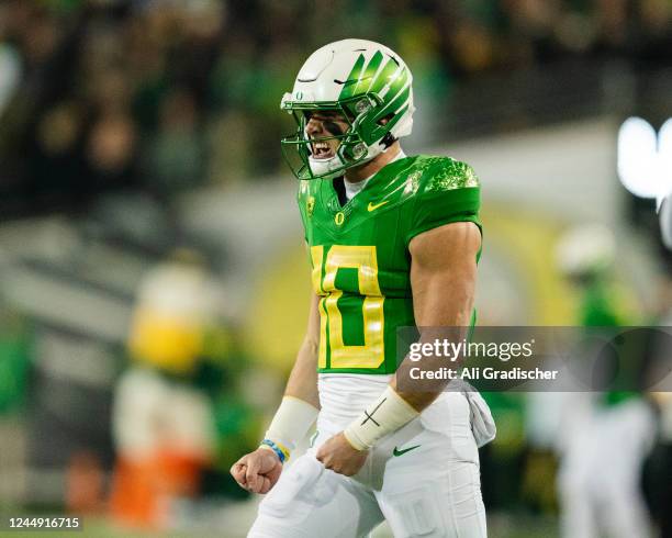 Quarterback Bo Nix of the Oregon Ducks celebrates after a successful field goal during the first quarter of the game against the Utah Utes at Autzen...