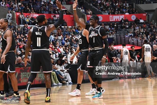 John Wall and Reggie Jackson of the LA Clippers high five during the game against the San Antonio Spurs on November 19, 2022 at Crypto.Com Arena in...