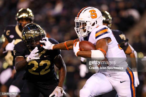Sean Tucker of the Syracuse Orange runs the ball during a football game between the Wake Forest Demon Deacons and the Syracuse Orange on Nov 19, 2022...