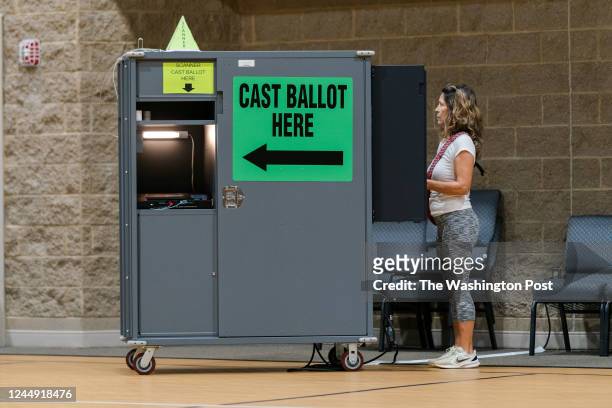 Voter casts her ballot at Kennesaw First Baptist Church in Marietta, Ga., on Tuesday, Nov. 8, 2022.