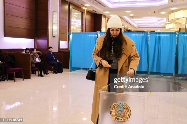 Kazakh citizen casts her vote in a ballot box during the snap presidential elections at a polling station in Astana, Kazakhstan on November 20, 2022.