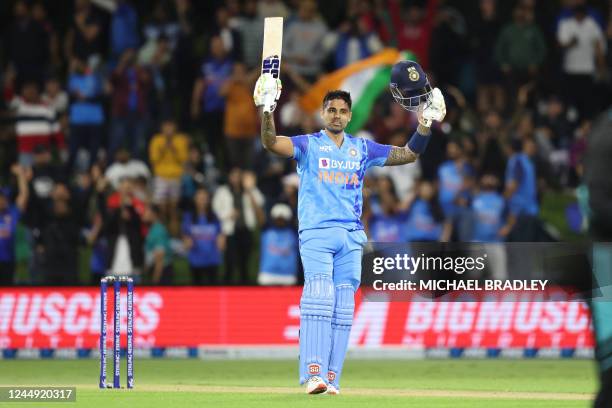 India's Suryakumar Yadav celebrates his century during the second Twenty20 cricket match between New Zealand and India at the Bay Oval in Mount...