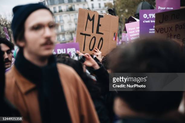 Demonstrator holds a sign with the slogan &quot;Me too&quot; during a demonstration to say &quot;Stop sexist and sexual violence&quot; organized by...
