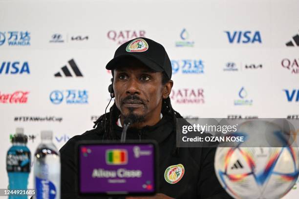 Senegal's coach Aliou Cisse attends a press conference at the Qatar National Convention Center in Doha on November 20 on the eve of the Qatar 2022...