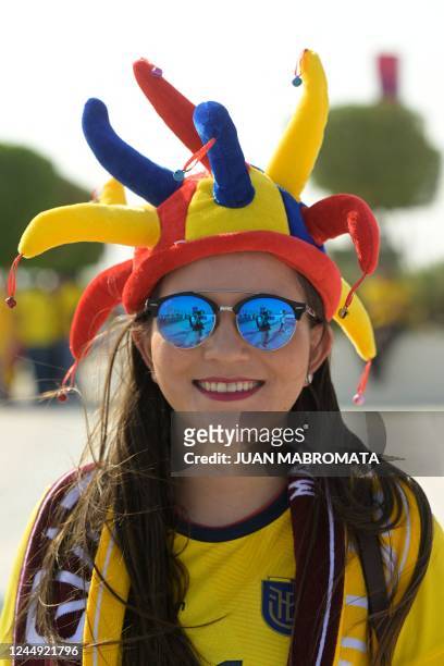 Fan of Ecuador poses for a picture as she arrives at Al-Bayt Stadium in Al Khor, north of Doha, on November 20 before the kick-off match of the Qatar...