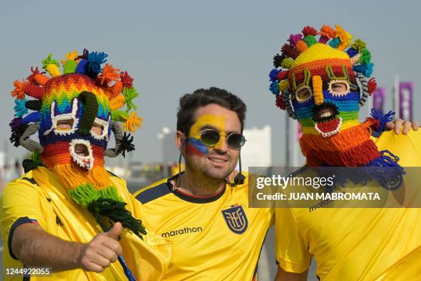 Fans of Ecuador pose for a picture as they arrive at Al-Bayt Stadium in Al Khor, north of Doha, on November 20 before the kick-off match of the Qatar...