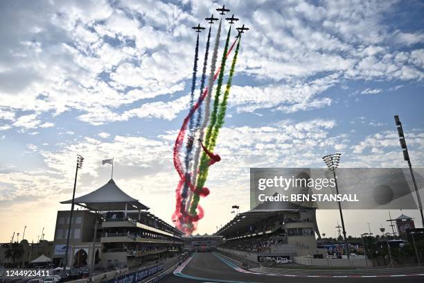 An aerobatic team performs ahead of the Abu Dhabi Formula One Grand Prix at the Yas Marina Circuit in the Emirati city of Abu Dhabi on November 20,...