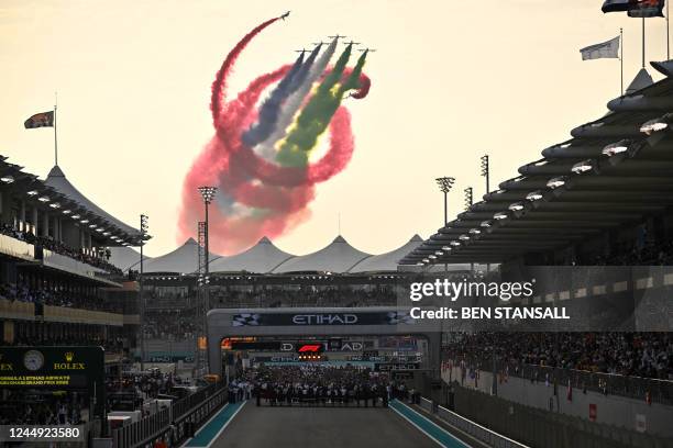 An aerobatic team performs ahead of the Abu Dhabi Formula One Grand Prix at the Yas Marina Circuit in the Emirati city of Abu Dhabi on November 20,...